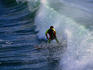 Surfing the waves off Maui beach - Maui, Hawaii