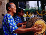 Musician playing drum at Erawan Shrine, Khannayao.