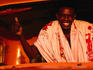 Smiling man inside truck.