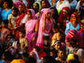 Crowd of women in traditional dress.