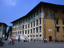 The graffiti decorated facade of Palazzo dei Cavaliee, which was redesigned by Vasari, on Piazza dei Cavalier, Pisa. Both were named after the Knights of St Stephen, a religious and military order founded by Cosimo I de' Medici.