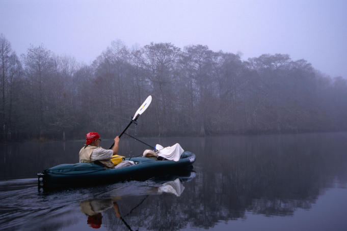 Kayaking through the misty Withlacoochee River Springs, taking care not to wake any alligators