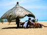 Women under beach umbrella, l'Auberge de Grande Popo.
