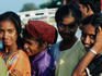 Young passengers wait on the Panaji pier for the ferry from the shores of Mandovi River.