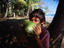 A local boy drinks coconut milk.