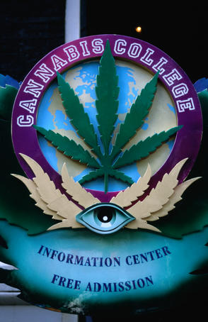 Sign for Cannabis College Information Center (Oudezijds Achterburgwal): Something you could only find in Amsterdam where small amounts of soft drugs such as cannabis are 'tolerated' by officials.