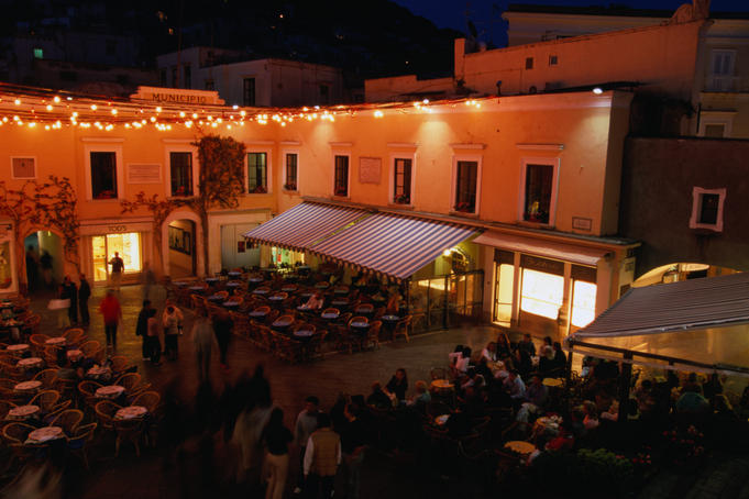 Summer evening in the 'heart' of Capri, Piazza Umberto I. The piazza is a small, closed-off square resembling a courtyard.