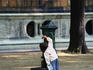 Young girl drinking from public water fountain - Milano, Lombardia