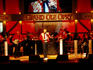 Country band playing on stage at Grand Ole Opry.