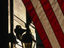 Traditional lamp-post and the American flag at Esplanade Ridge in New Orleans.
