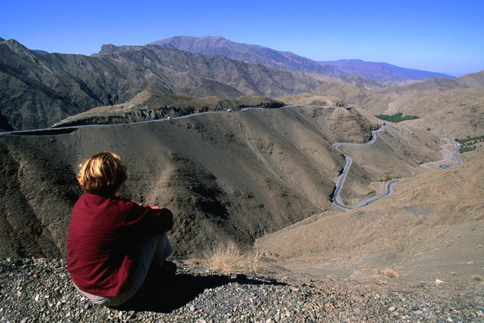 The Tizi-n-Tichka Highway winds through mountainous landscape in the Atlas Mountains.