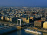 Elizabeth Bridge crossing Danube River, with city buildings in background.