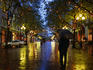 Lone figure on rainy evening in Occidental Square.