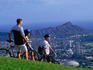 Cyclists taking in the view of Honolulu from Mt Tantalus, Pu'u Ulaka'a State Wayside Park.