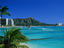 View of hotel resorts and sail boats on Diamond Head beach.