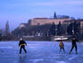 Playing ice hockey under the Vysehread Fortress on the frozen section of the Vltava River, Podoli.