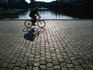 Cycling the cobblestones of the Rasin Embankment along the Vltava River.