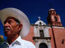 A local caballero waits for a bus near Templo de San Javier in Guanajuato.