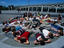 A group of students relaxing on a sun dial in Bicentennial Park.