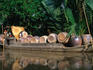 Large pots being transported on a traditional boat in the Mekong Delta, near Ho Chi Minh City