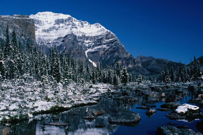 Mount Temple (11,626ft or 3544m) in Banff National Park. The massive, bulky, rock peak, was the first 11,000 foot peak in the Canadian Rockies to be climbed (1894).