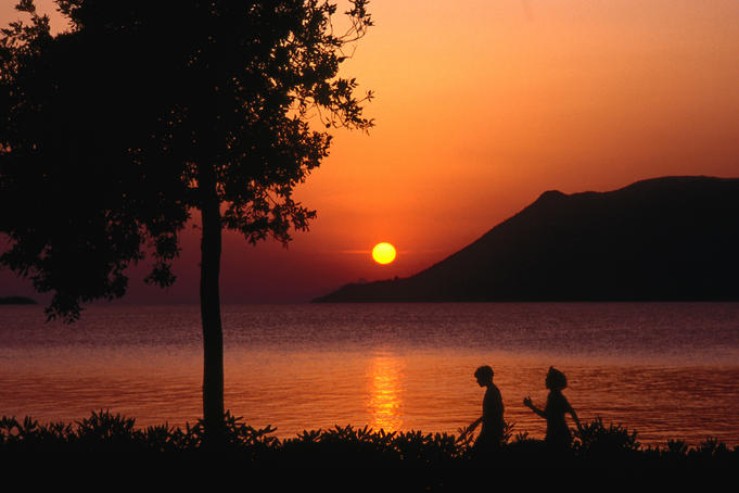 A couple take a sunset walk in Korcula.