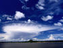 Cumulonimbus cloud formation over river.