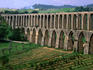 The 17th century Aqueduto de Pegoes with 180 arches was designed to carry water to Convento de Christo.