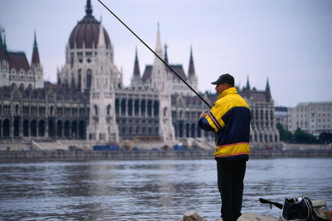 A fisherman with a view, fishing the Danube River across from the Budapest Parliament Buildings.