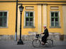 Cycling cobbled Szechenyi utca in Eger.