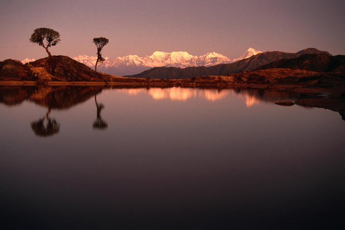 Sunrise view of lake at Gupa Pokhari with Makalu Himal in background.