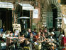 People sitting outside cafe on Piazza Navona.