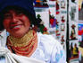 An Otavalo native woman selling blankets at the market.
