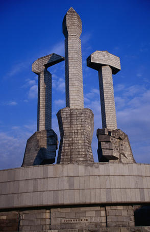 Monument to Party Foundation (sickle, hammer and brush).