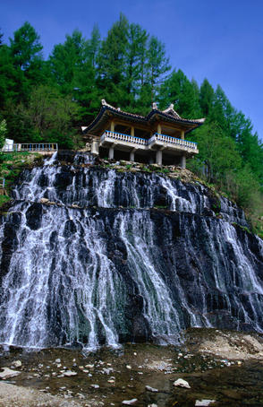 The waterfalls of Rimyongsu. The water comes straight through the mountain (not over the cliffs) and passes beneath the viewing pagoda into the river below.