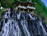 The waterfalls of Rimyongsu. The water comes straight through the mountain (not over the cliffs) and passes beneath the viewing pagoda into the river below.