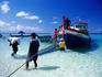 Unloading a supply ship on Hat Laem Tong on Ko Phi-Phi Don