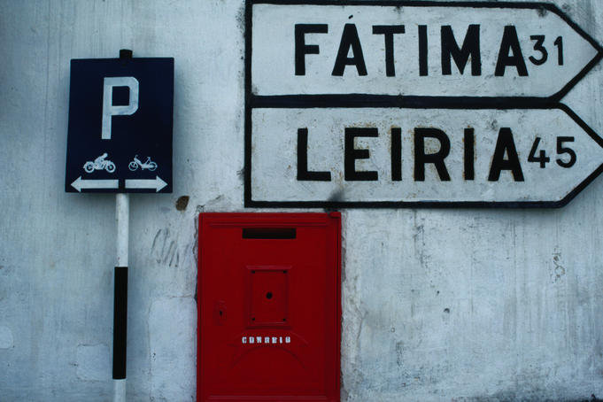 Street signs and letterbox in Tomar.