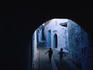 Two boys running through Kasbah, Chefchaouen