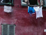 Laundry and garlic drying from upstairs window.