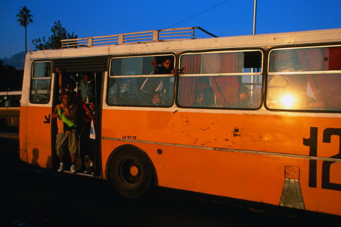 The distinctive yellow buses which dominate Santiago's traffic