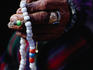 Loba nomad counting prayer beads.