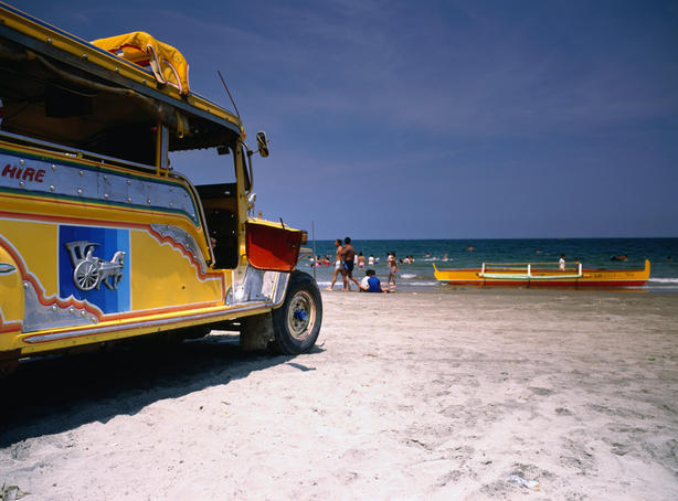 Yellow Jeepney on the beach.