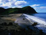 Beach and hills in distance.
