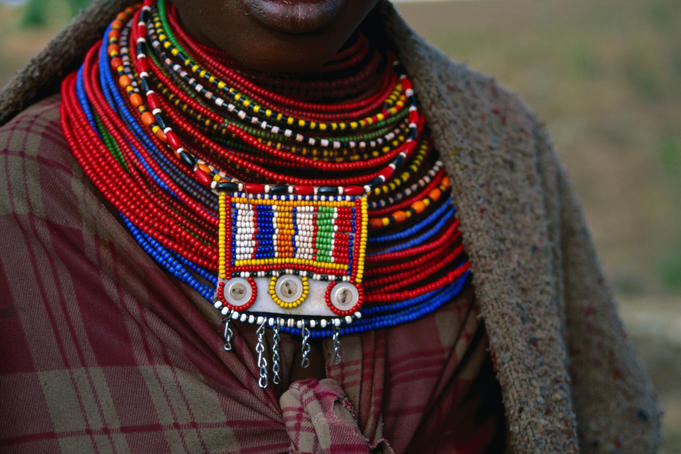 Northern Maasai, Samburu woman in traditional dress with beaded necklace.