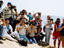 Paparazzi photographers on beach.