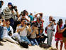 Paparazzi photographers on beach.