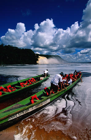 Tourists head out to the Lost World waterfalls in Canaima National Park.