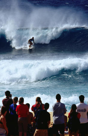 A surfing contest at the Banzai Pipeline, north shore of Oahu.