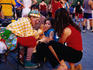 Face painting youngsters on Place Jacques-Cartier in Montreal.
